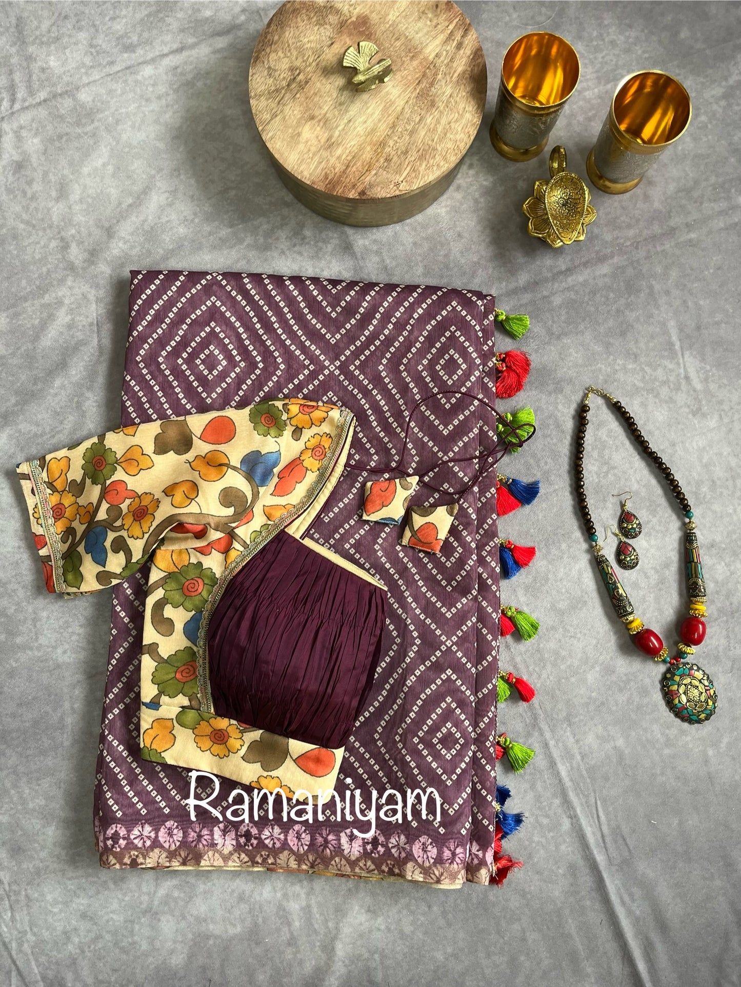 Wine color Organza Bandhani saree with a Kalamkari pallu