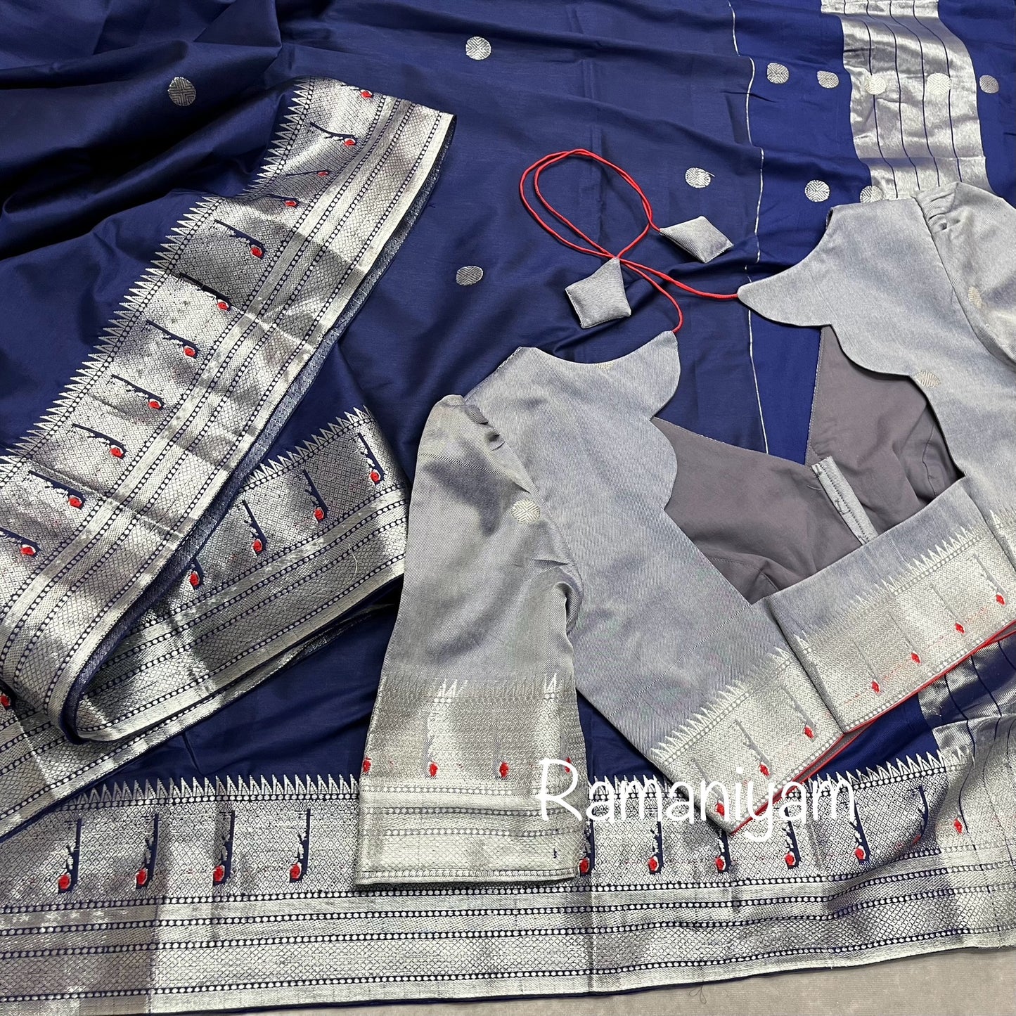 Navy blue Paithani saree with silver Muniya borders