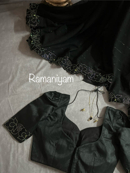 Party wear Black georgette saree featuring a beautiful cutwork border with crystal finishing