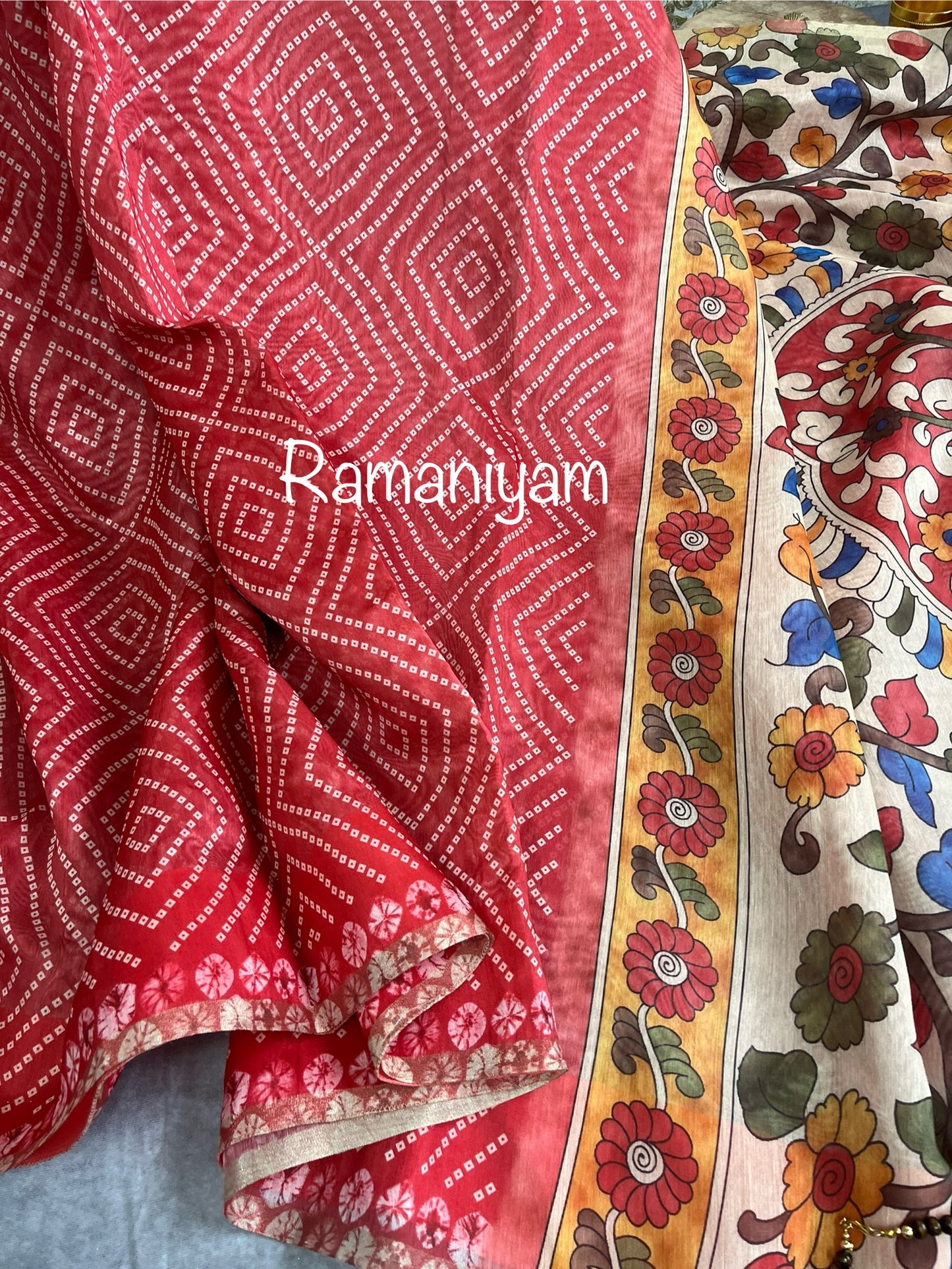 Peach red Organza Bandhani saree with a Kalamkari pallu