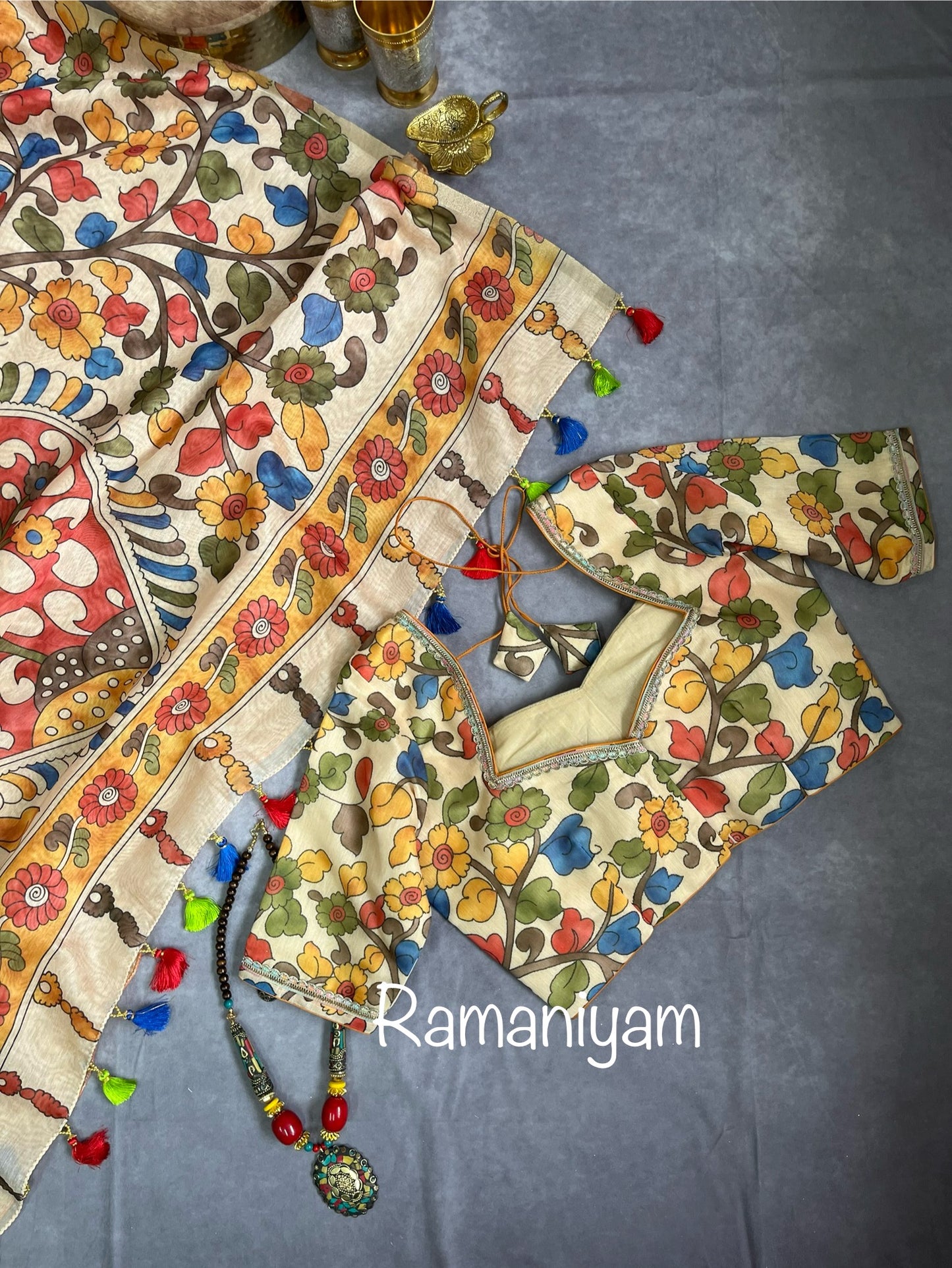 Mustard yellow Organza Bandhani saree with a Kalamkari pallu