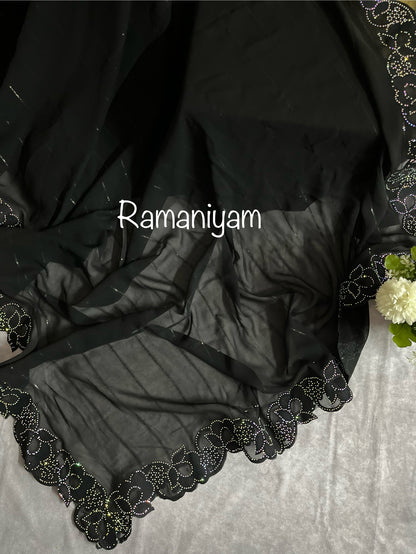 Party wear Black georgette saree featuring a beautiful cutwork border with crystal finishing