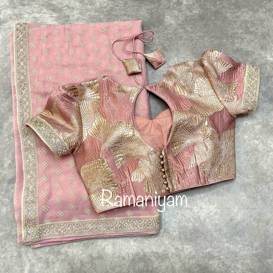 Rose pink tissue georgette saree with stone work borders and metallic rose pink blouse