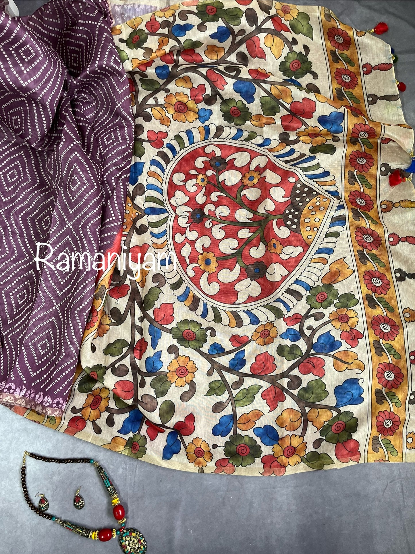 Wine color Organza Bandhani saree with a Kalamkari pallu