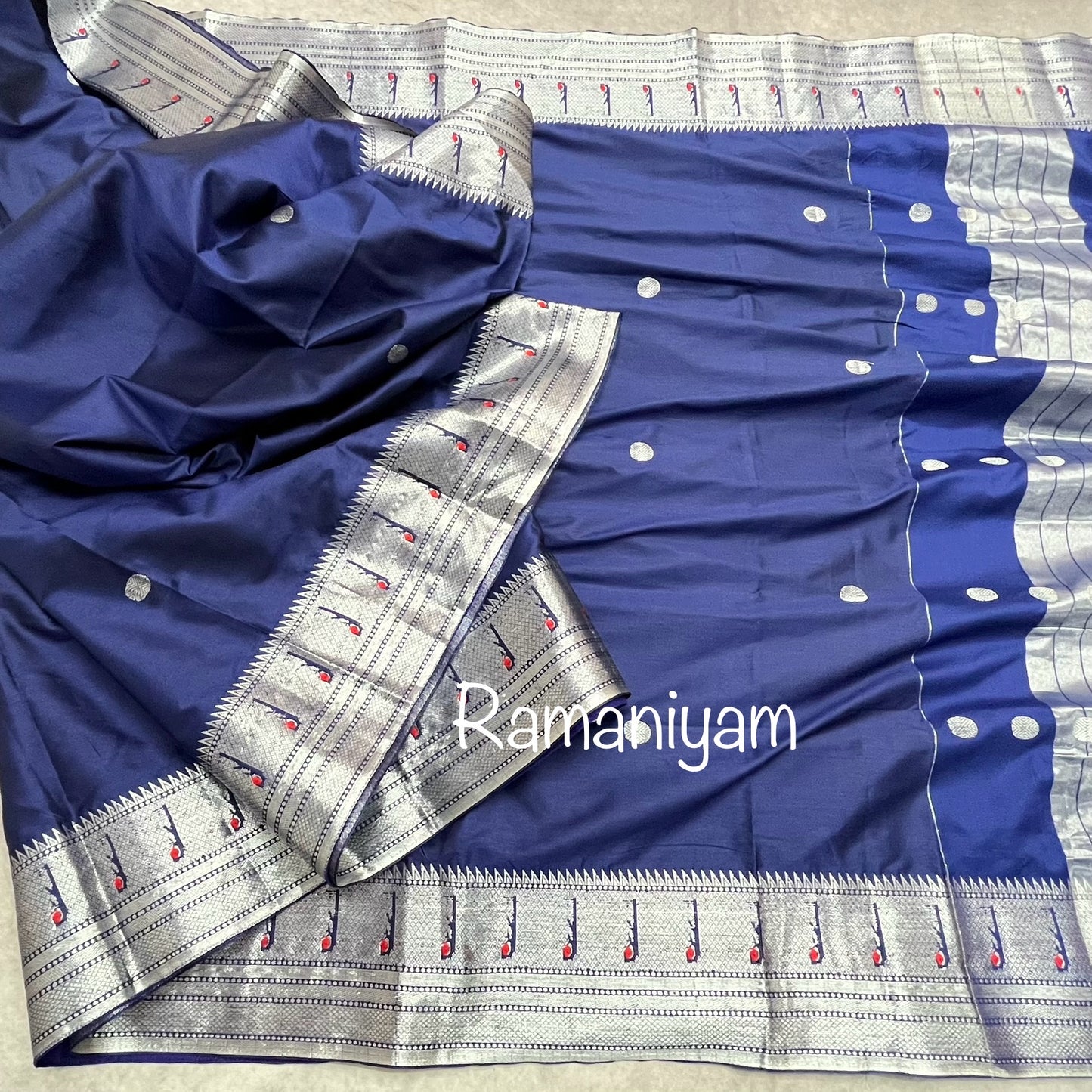 Navy blue Paithani saree with silver Muniya borders