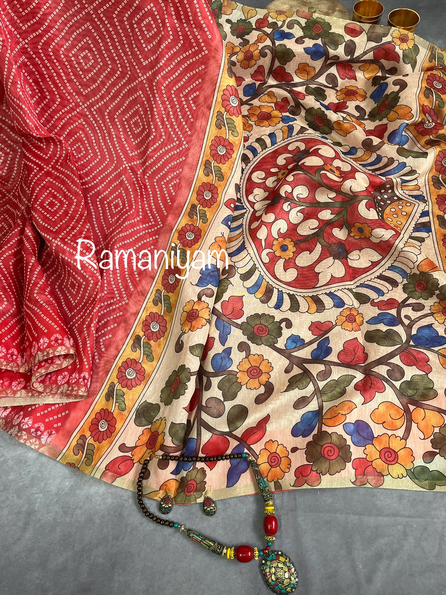 Peach red Organza Bandhani saree with a Kalamkari pallu