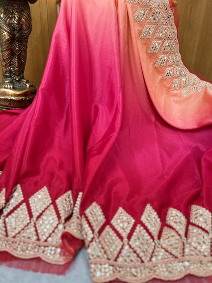 Party wear pink and red shaded crape silk saree embellished with intricate mirror work