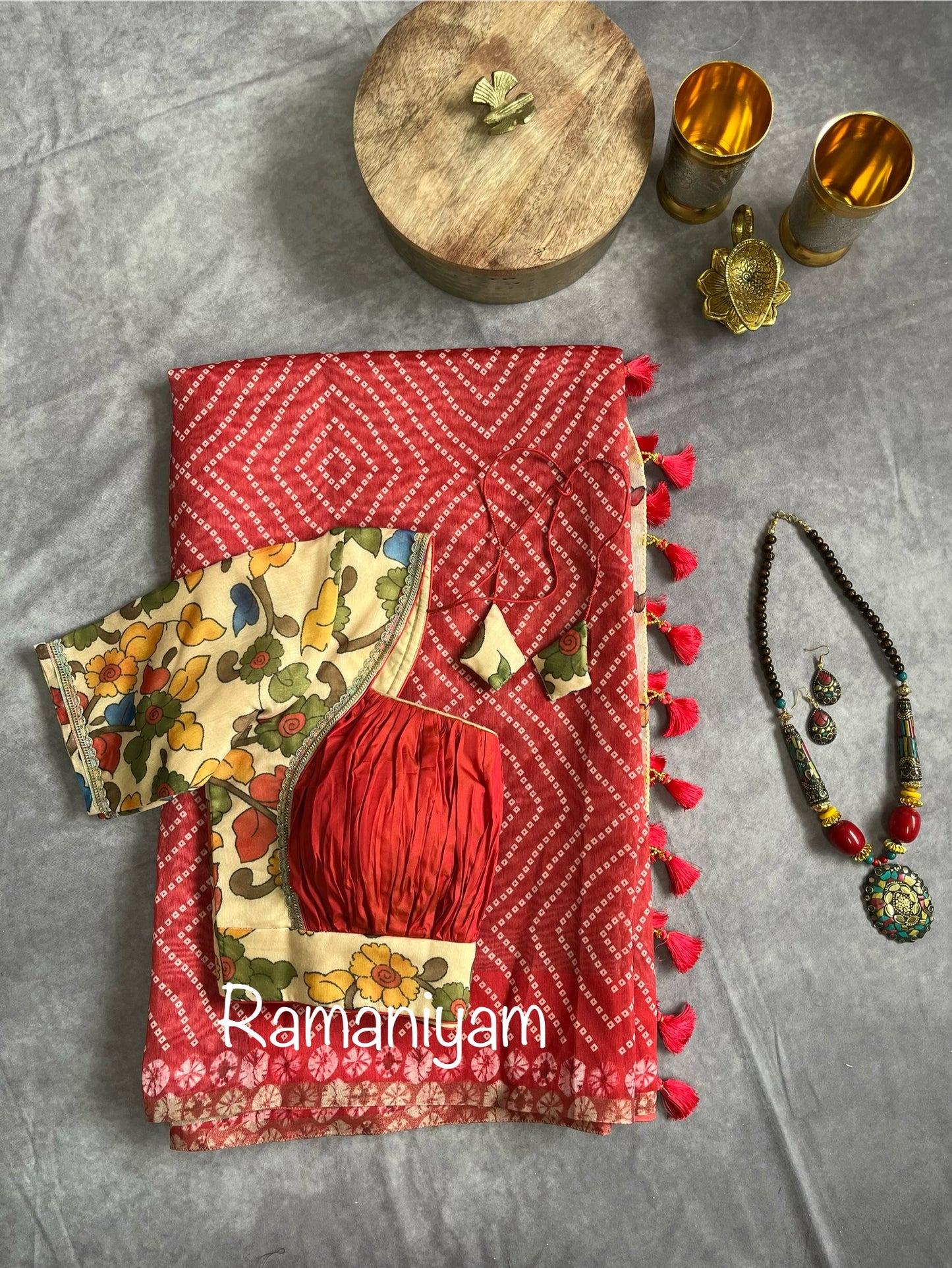 Peach red Organza Bandhani saree with a Kalamkari pallu