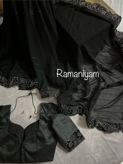 Party wear Black georgette saree featuring a beautiful cutwork border with crystal finishing