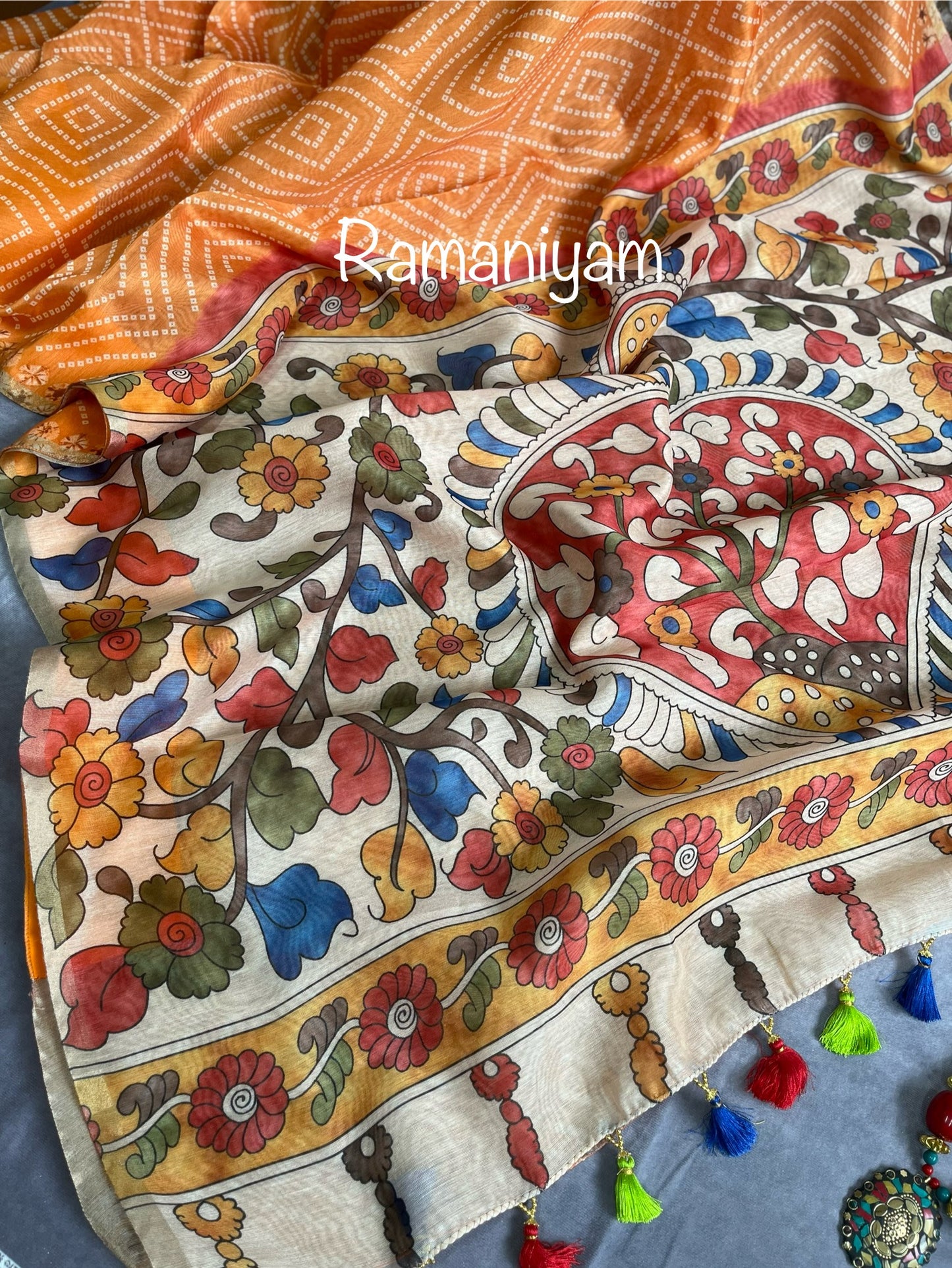 Mustard yellow Organza Bandhani saree with a Kalamkari pallu