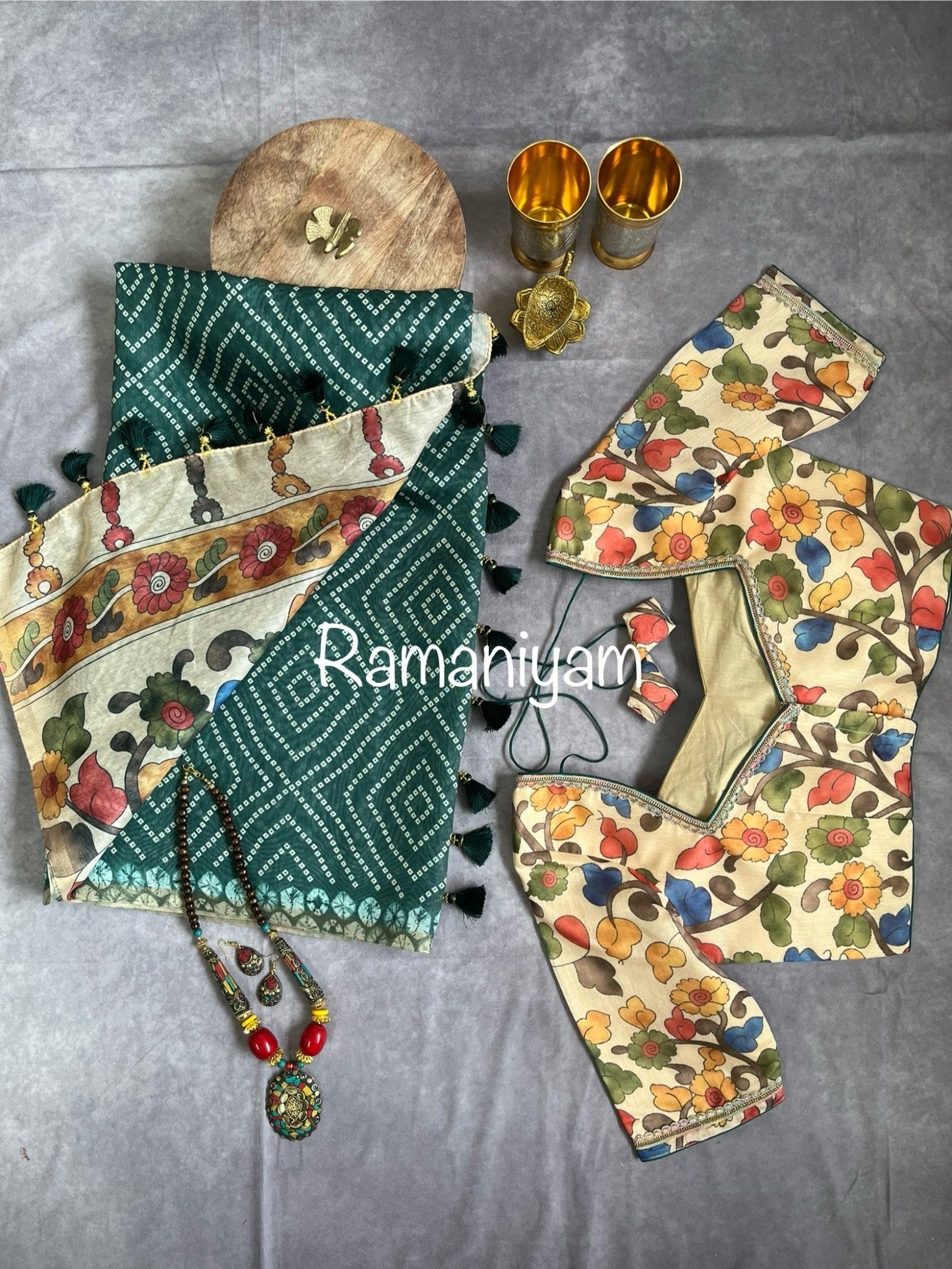 Bottle green Organza Bandhani saree with a Kalamkari pallu - Ramaniyam USA