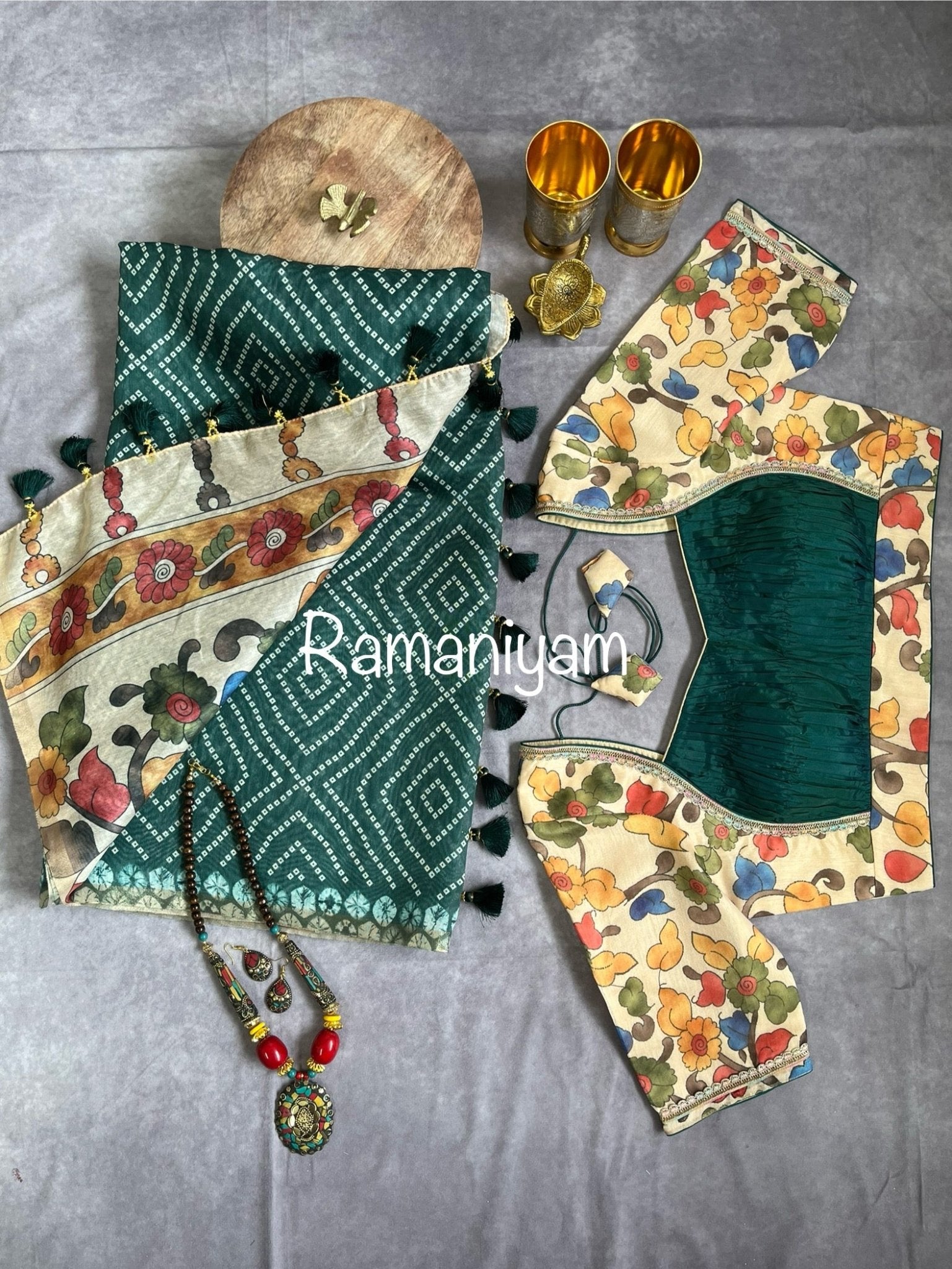 Bottle green Organza Bandhani saree with a Kalamkari pallu - Ramaniyam USA