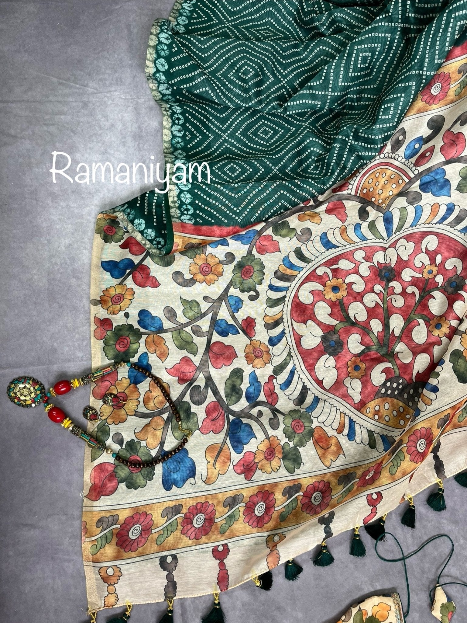 Bottle green Organza Bandhani saree with a Kalamkari pallu - Ramaniyam USA