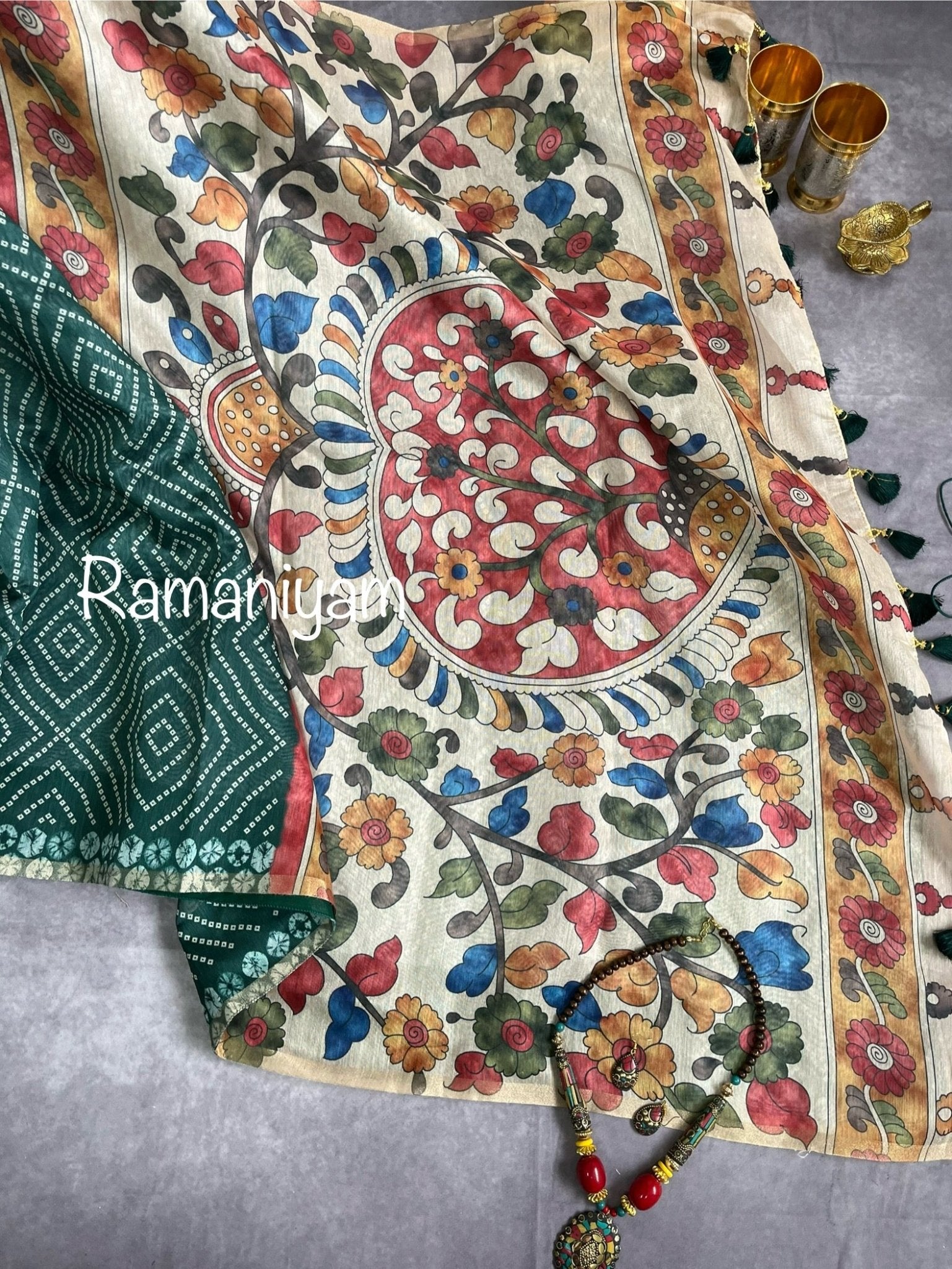 Bottle green Organza Bandhani saree with a Kalamkari pallu - Ramaniyam USA